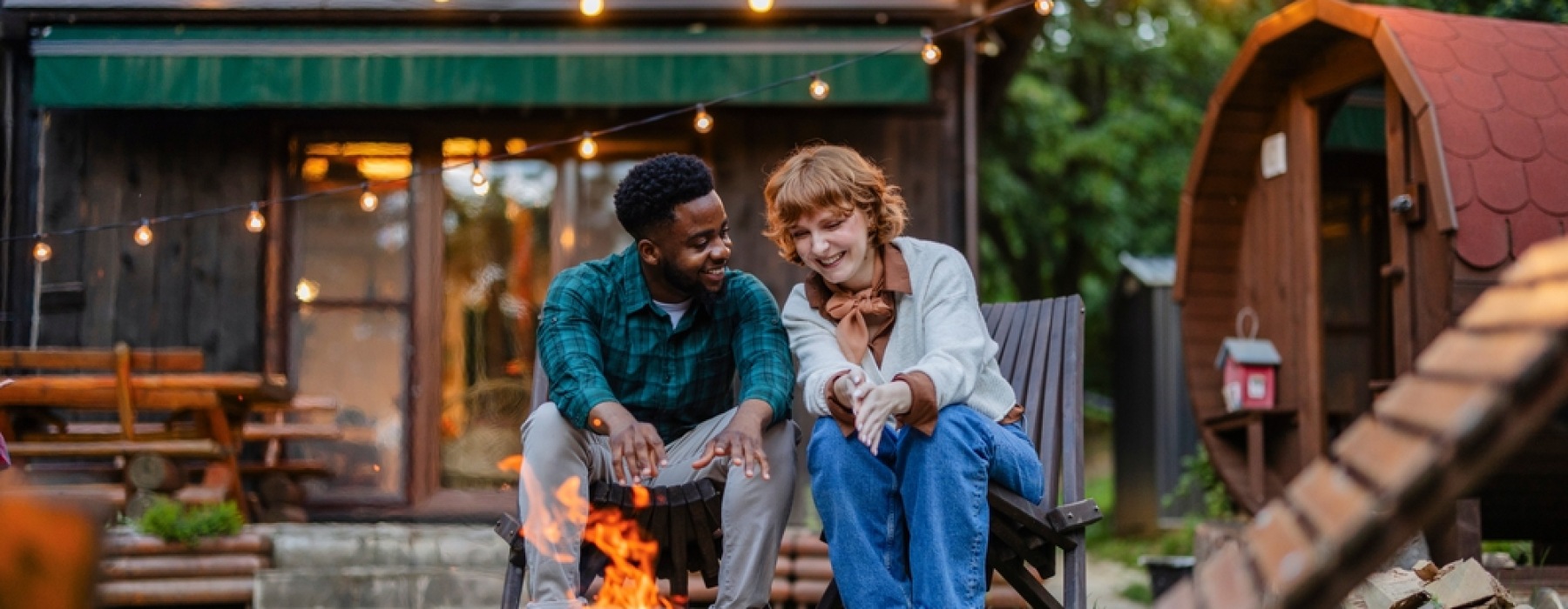 Couple sitting outdoors smiling