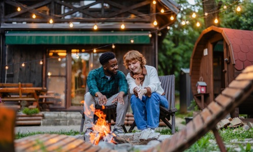 Couple sitting outdoors smiling