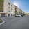 Naples, FL Studios For Rent - The Pearl Founders Square Apartments - Outdoor Parking Lot With Assigned Parking Spaces And Garages