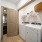 bright laundry room with side-by-side washer/dryer